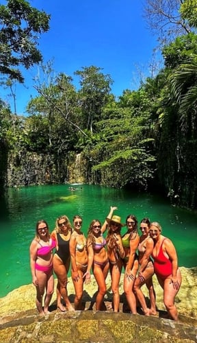 Underground cenote with turquoise water and natural rock formations